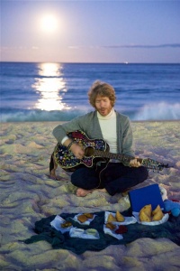 Nadav singing, chanting & playing guitar